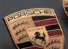 Porsche представила обновленную фирменную эмблему